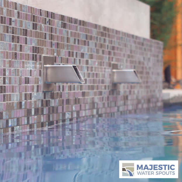 Stainless Steel Square Water Spouts in Pool Retaining Wall