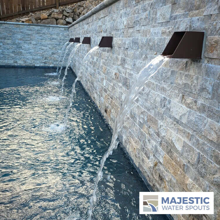 4" Textured Rust Scuppers in Pool Water Feature Wall